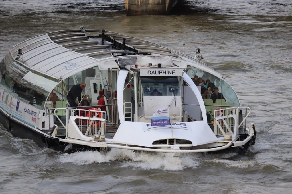 Modern white boat with glass windows on water