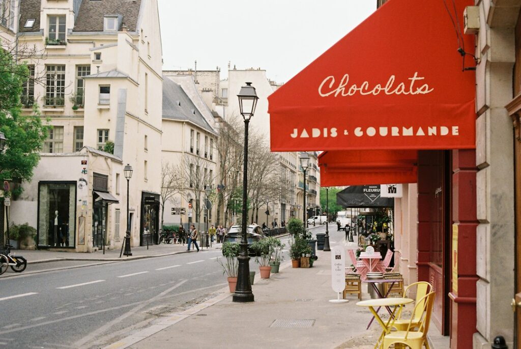 Charming parisian street with cafe and shops