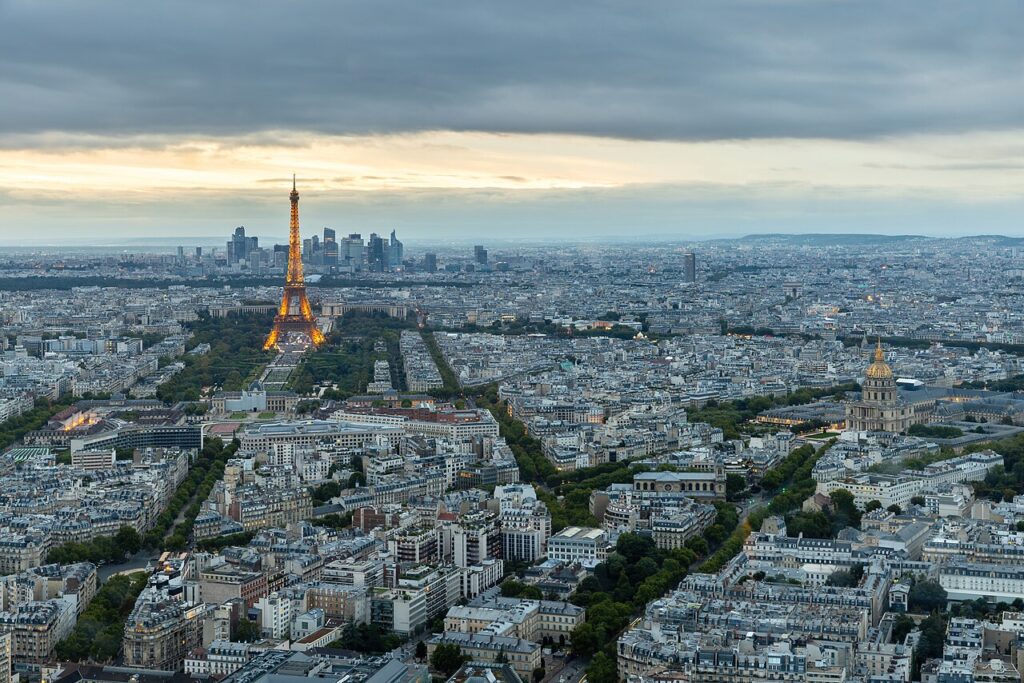 Panoramic view on the illuminated 7th arrondissement of Paris at sunset in France.jpg